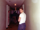 Jim Neilsen in the barracks hallway. Mosley on the left in the doorway. 