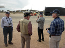Bob Strand, Chuck Schabel and Steve Carr with Charlie. B-52 and submarine sail in the background