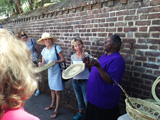 The group learns about traditional Gullah basket weaving