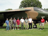 The guys pose in front of the F-111.