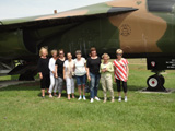 The gals pose in front of the F-111
