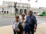 Pauline Bisel, Joan and Bob Strand pose in front of Union Station