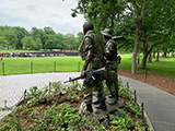 Vietnam Soldier Statue with the memorial in the background