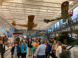 Jon Crawford (2nd from left, back row by the display case) and Bob Fitzgerald (blue coat in the center) touring the museum